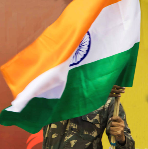 istock indian army personal holding Indian Flag 1073047162