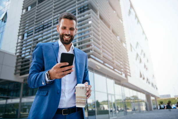 istock Handsome young businessman talking on his phone 1073047762
