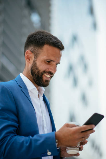 istock Handsome young businessman talking on his phone 1073048302