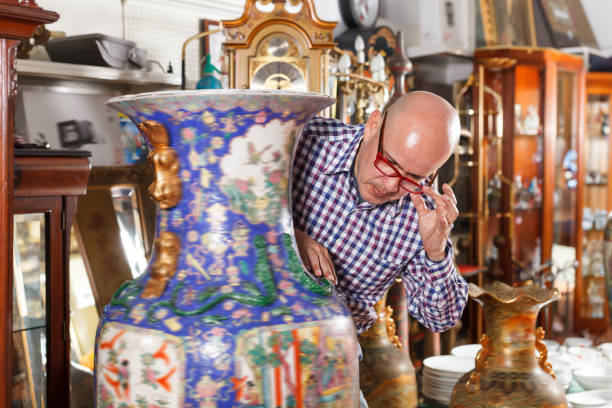 istock Interested glad man measuring vintage amphora 1073048454