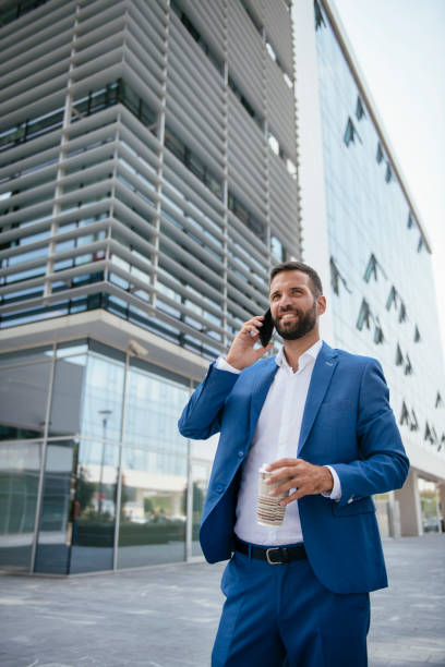 istock Handsome young businessman talking on his phone 1073050648