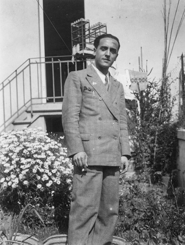 1930s 1940s 1950s outdoor shot of a young elegant suit dressed italian man