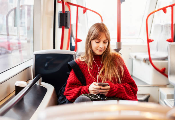 istock Young woman riding in public transportation 1073058552