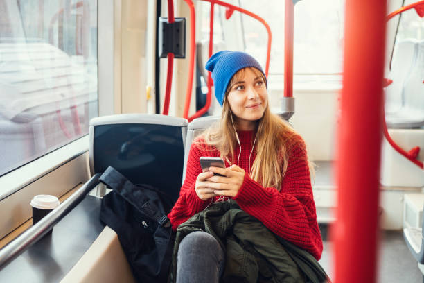 istock Young woman riding in public transportation 1073058562