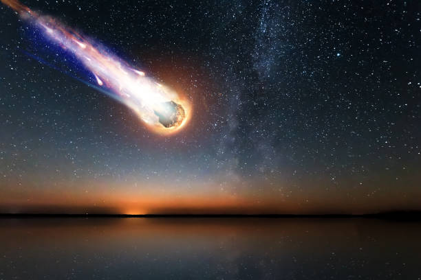 A comet, an asteroid, a meteorite falls to the ground against a starry sky. Attack of the meteorite. Meteor Rain. Kameta tail. End of the world. Astranomy. A comet, an asteroid, a meteorite falls to the ground against a starry sky. Attack of the meteorite. Meteor Rain. Kameta tail. End of the world. Astranomy. asteroid stock pictures, royalty-free photos & images