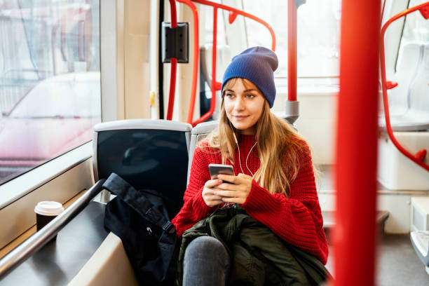 istock Young woman riding in public transportation 1073059012