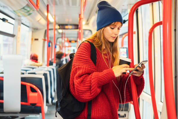 istock Young woman riding in public transportation 1073060888
