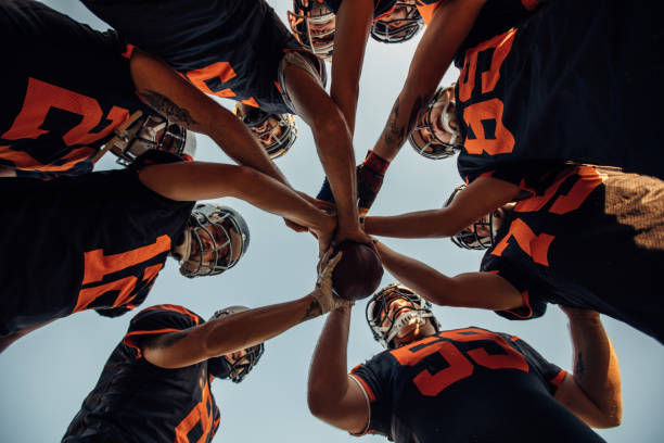 istock Football players unity 1073064664