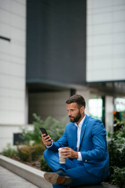istock Handsome young businessman talking on his phone 1073064982