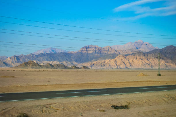 istock Power lines passing through the mountains of Egypt 1073072508
