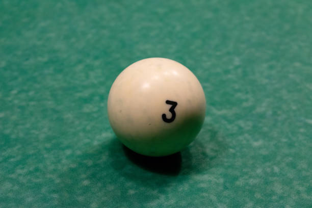 istock Billiard balls on a green pool table. 1073076490