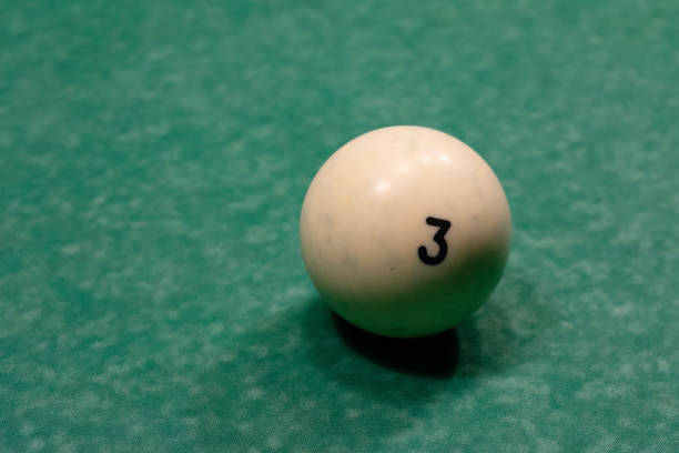 istock Billiard balls on a green pool table. 1073076920