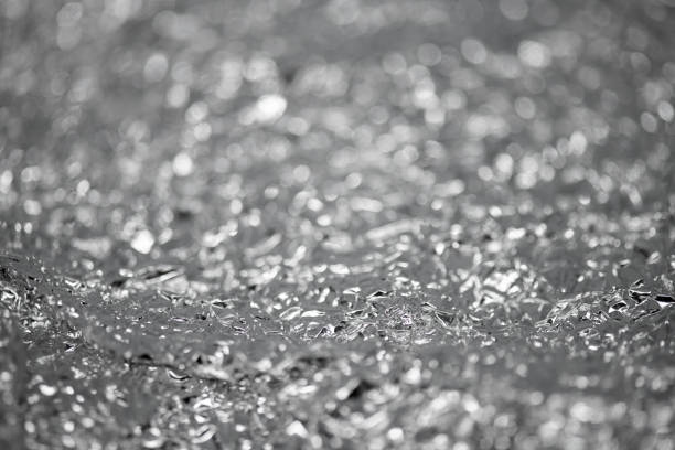 istock Crumpled aluminum silver foil background 1073084280