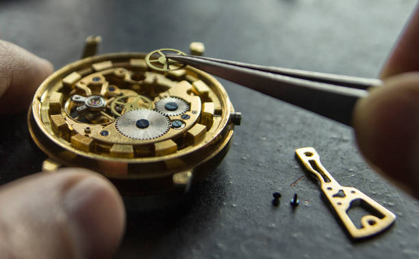 istock Watchmaker is repairing the mechanical watches in his workshop 1073088614