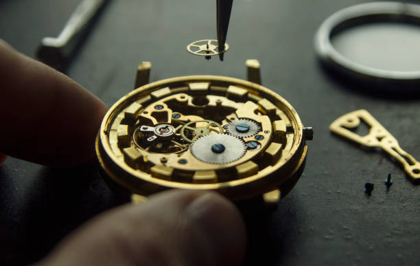 istock Watchmaker is repairing the mechanical watches in his workshop 1073089498