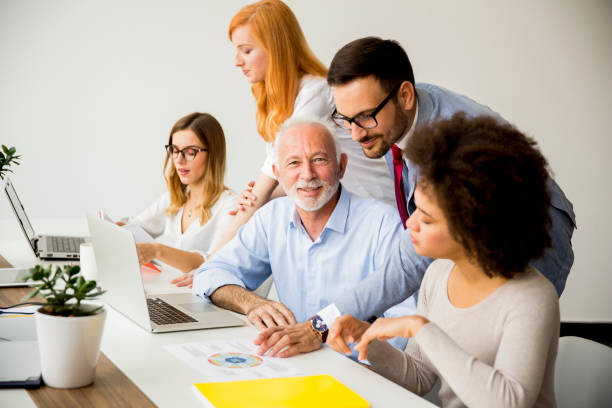 istock Joyful multiracial business team at work in modern office 1073094008