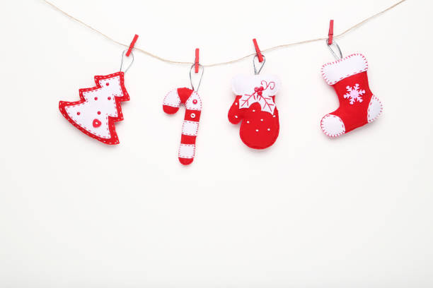 istock Soft christmas toys hanging on white background 1073097724