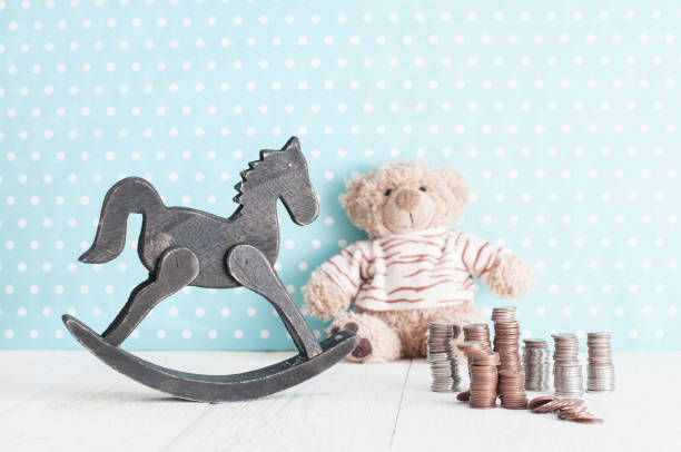 toy horse, teddy bear and change stock photo