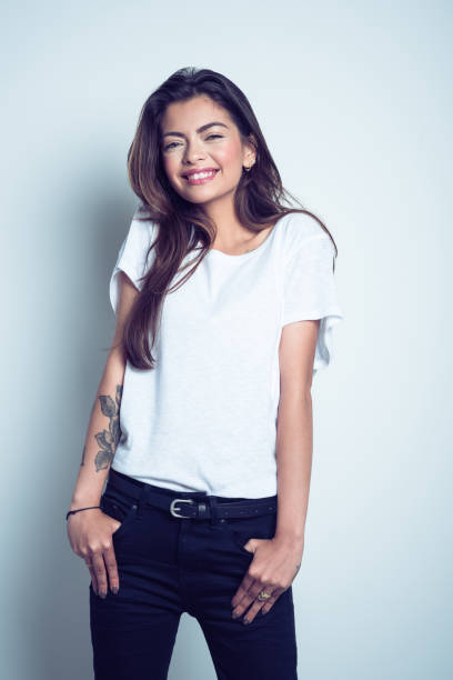 istock Happy young woman smiling at camera 1073106064