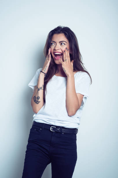 istock Surprised young woman smiling at camera 1073107012
