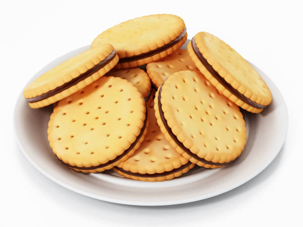 istock Sandwich cookies inside white plate isolated on white. 1073108386