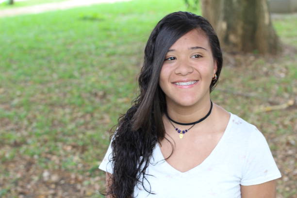 istock Mixed race young girl smiling with copy space 1073110320