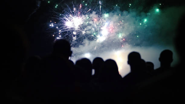 istock Crowd watching fireworks and celebrating new year 1073124824