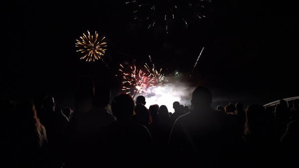 istock Crowd watching fireworks and celebrating new year eve 1073124826
