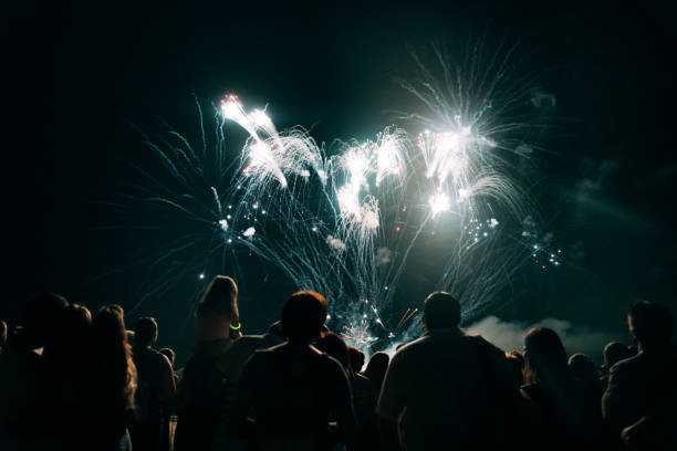 istock Crowd watching fireworks and celebrating new year eve 1073124830