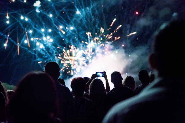 istock Crowd watching fireworks and celebrating new year 1073124942