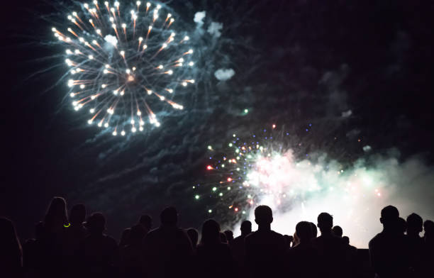 istock Crowd watching fireworks and celebrating new year 1073124958