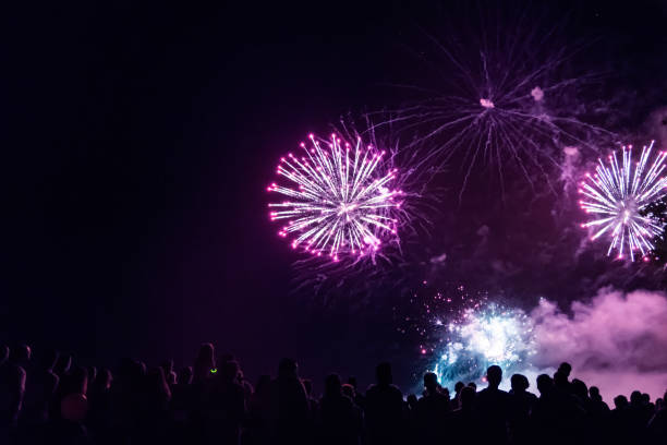 istock Crowd watching fireworks and celebrating new year eve 1073124960