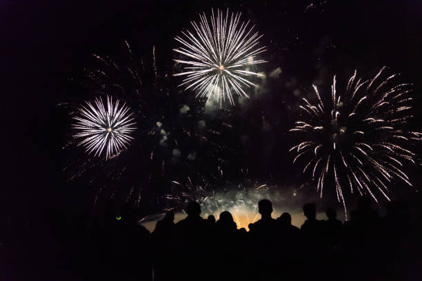 istock Crowd watching fireworks and celebrating new year eve 1073125160