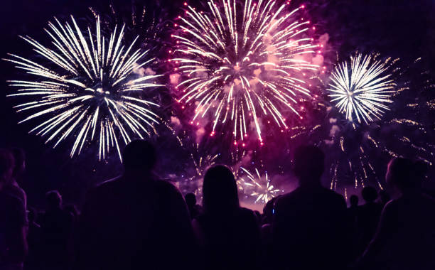 istock Crowd watching fireworks and celebrating new year 1073125166