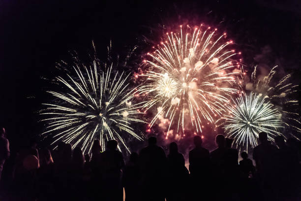 istock Crowd watching fireworks and celebrating new year 1073125190