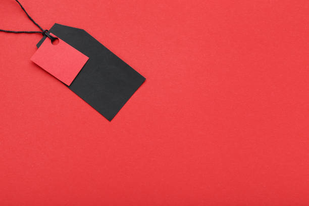 istock Black sale tag on red background 1073126794