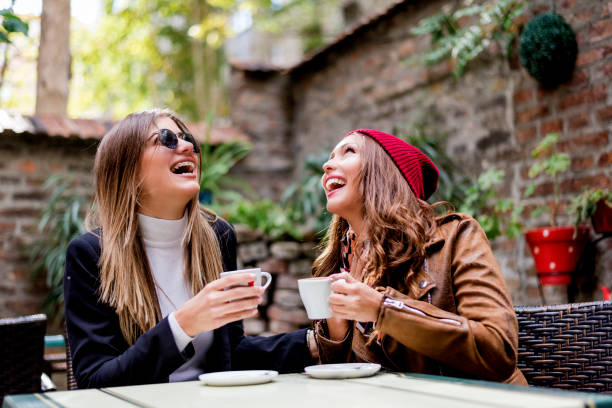 istock Two girlfriends are making fun in the cafeteria 1073129378