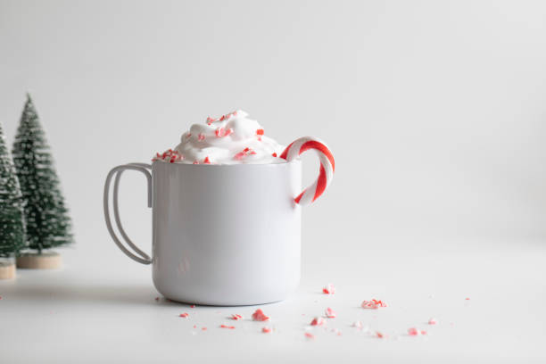 istock Candy canes in white mug and small Christmas tree 1073131166