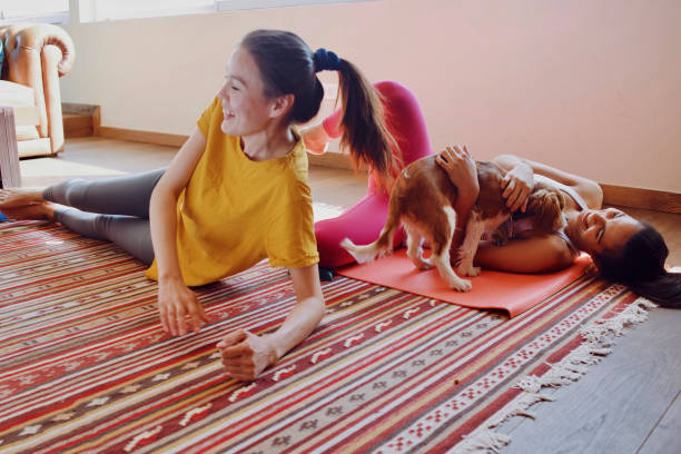 istock two friends having fun at home and taking a break from workout at home 1073131208