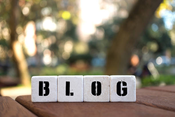 istock BLOG Concept with alphabet blocks on wooden table. 1073131374