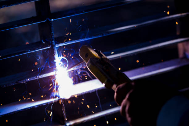 istock Welder erecting technical steel. Industrial steel welder in factory technical. 1073131812