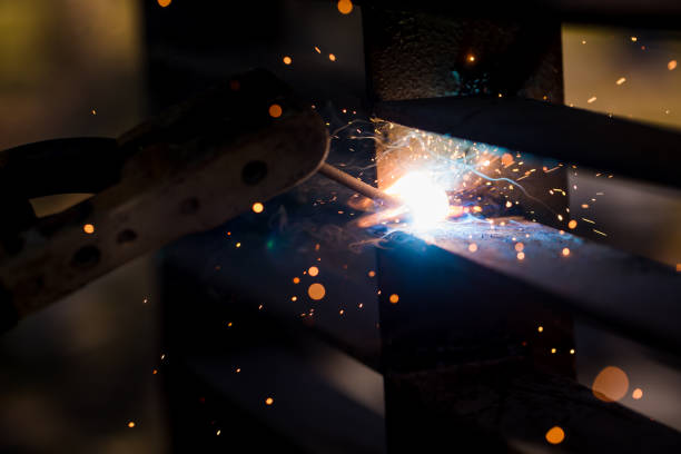 istock Welder erecting technical steel. Industrial steel welder in factory technical. 1073131914