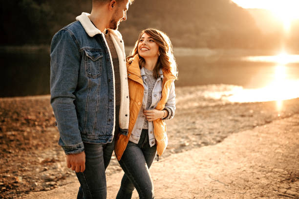 istock Young couple walking on sunshine 1073133352