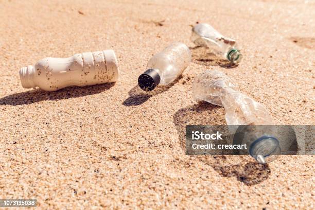 Coastal Plastic Pollution Stock Photo - Download Image Now - Beach, Bottle, Bright