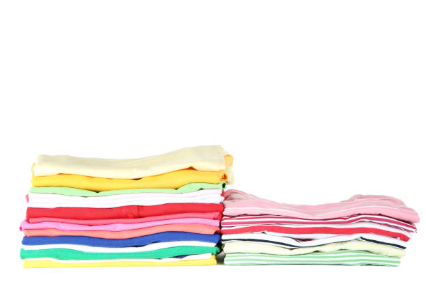 istock Stacks of folded clothes on white background 1073136108