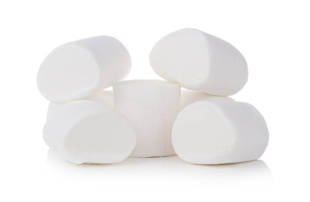 istock Group of tasty white marshmallows isolated on white background 1073136950