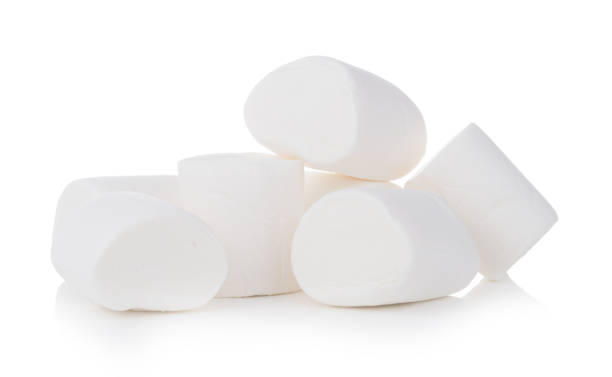 istock Group of tasty white marshmallows isolated on white background 1073136956