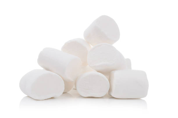 istock Group of tasty white marshmallows isolated on white background 1073136958