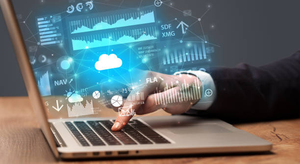istock Hand typing on laptop graphs and charts and reports concept around 1073146206
