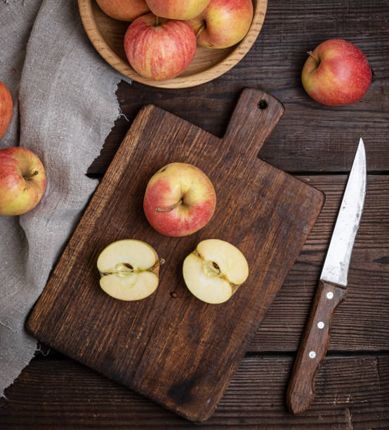 istock ripe red apples, chopping wooden board 1073154606